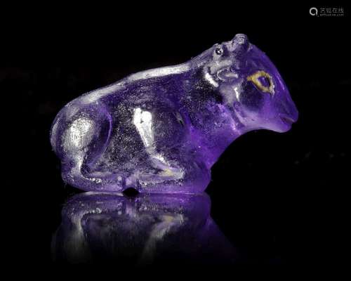 A WESTERN ASIATIC HARDSTONE AMULET OF A SEATED COW OR OX, CI...