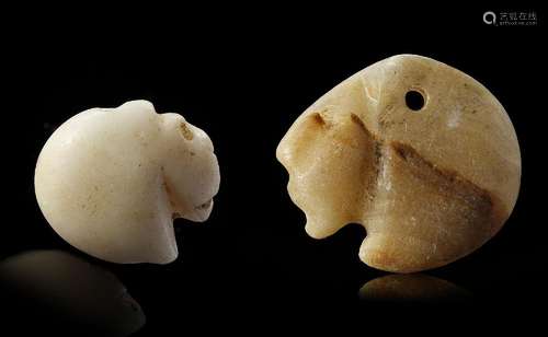 TWO WESTERN ASIATIC SEAL AMULETS IN THE FORM OF LION HEADS, ...