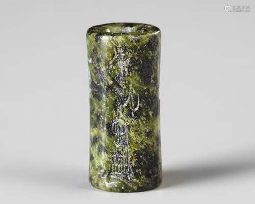 A WESTERN ASIATIC GREEN SERPENTINE CYLINDER SEAL, CIRCA 1900...