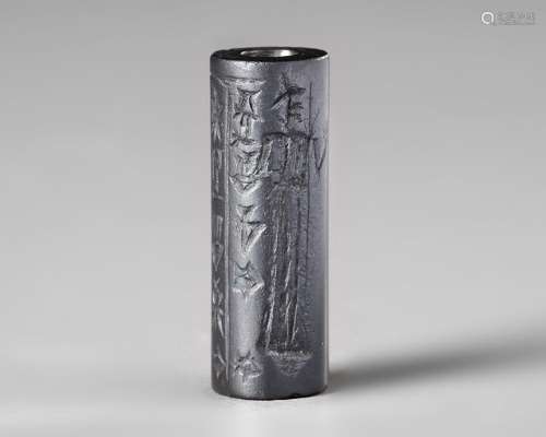 WESTERN ASIATIC HEMATITE CYLINDER SEAL, CIRCA 1900-1700 B.C.