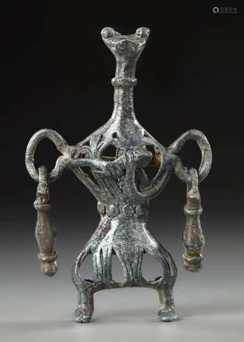 A WESTERN ASIATIC AMLASH OPENWORK BRONZE IDOL, CIRCA 1ST MIL...