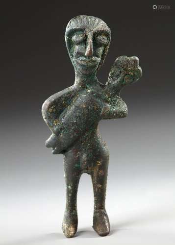 A WESTERN ASIATIC BRONZE MOTHER AND BABY, CIRCA LATE 2ND MIL...