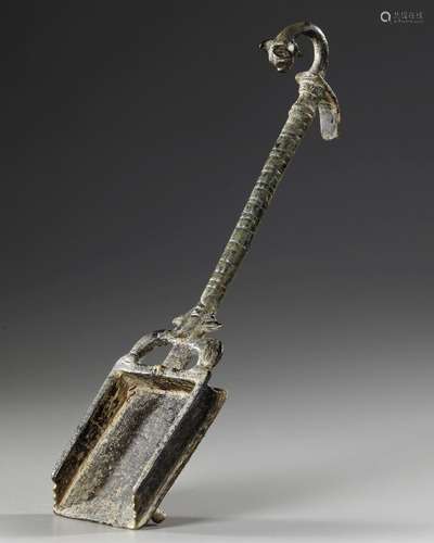 A ROMAN BRONZE INCENSE SHOVEL WITH A PANTHER HEAD, CIRCA 1ST...