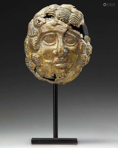 A GRECO-ROMAN GILT BRONZE MASK, CIRCA 1ST CENTURY B.C. / A.D...