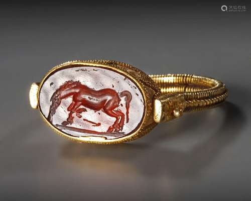 A GREEK GOLD RING WITH GARNET INTAGLIO, HELLENISTIC PERIOD, ...