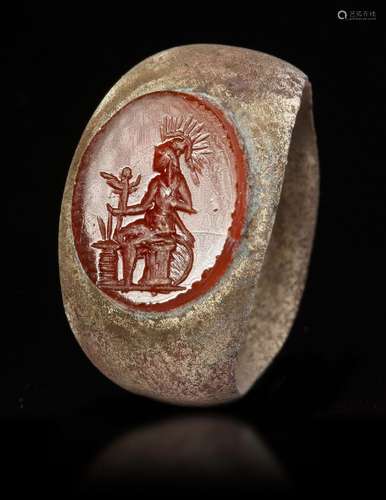 A ROMAN BRONZE RING WITH CARNELIAN INTAGLIO, CIRCA 2ND-3RD C...