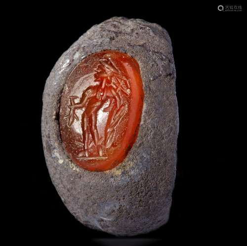 A ROMAN SILVER RING WITH A CARNELIAN INTAGLIO SHOWING MERCUR...