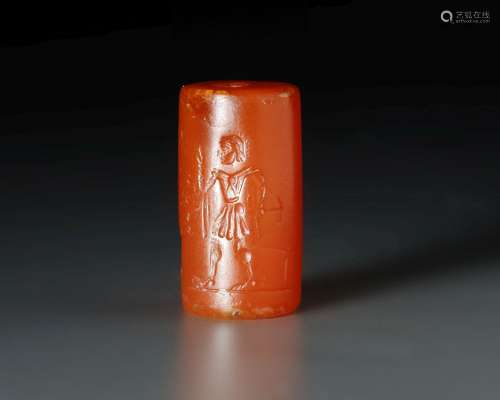 A GRECO PERSIAN AGATE CYLINDER SEAL WITH A MAN AND WINGED BU...