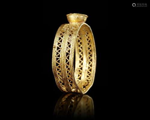 A BYZANTINE GOLD FINGER RING, CIRCA 6TH-7TH CENTURY A.D.