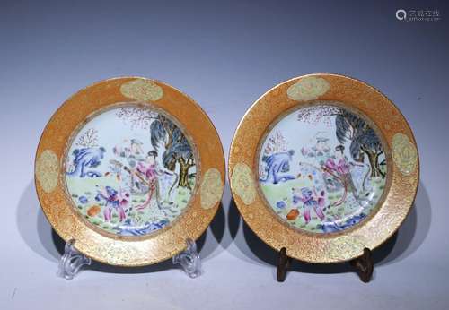 A pair of allite red glazed famille-rose 'figure' dish paint...