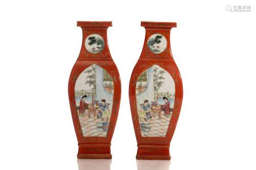 PAIR OF RED GROUND FAMILLE ROSE VASES