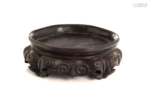 AN EARLY CHINESE CARVED HARDWOOD STAND