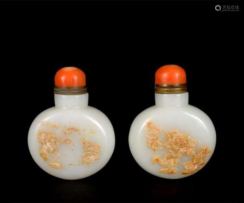 A pair of white jade snuff bottle