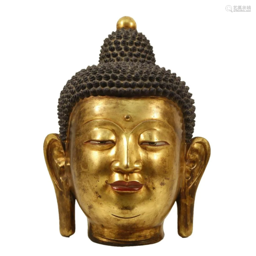 A Gilt-Bronze Head Of Buddha Shakyamuni