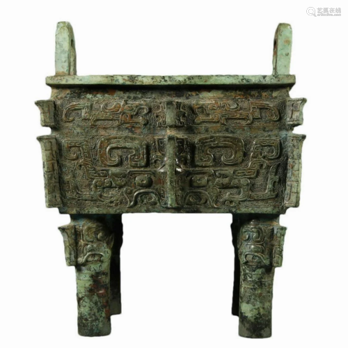 A Ancient Bronze 'Animal Mask' Quadripod Ritual Fo...