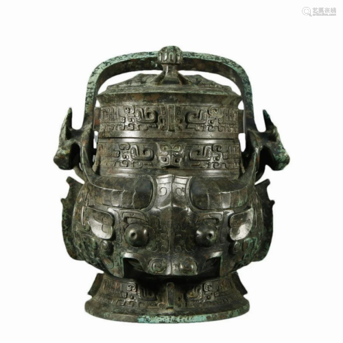 A Ancient Bronze 'Animal Mask' Wine Vessel With In...