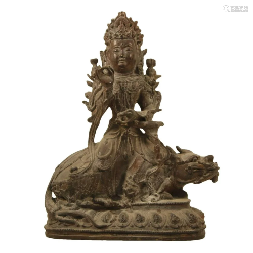 A Bronze Figure Of Guanyin Seated On A Beast