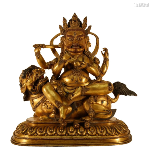 A Gilt-Bronze Figure Of Jambhala Seated On A Lion With Inscr...