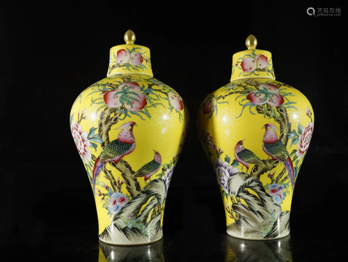 A pair of yellow-ground famille-rose jars