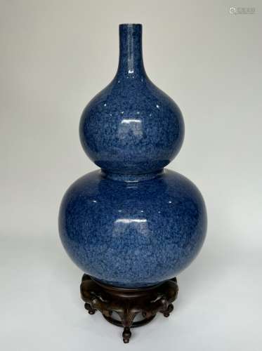 A blue spotted with snow like decorations guard type vase, m...