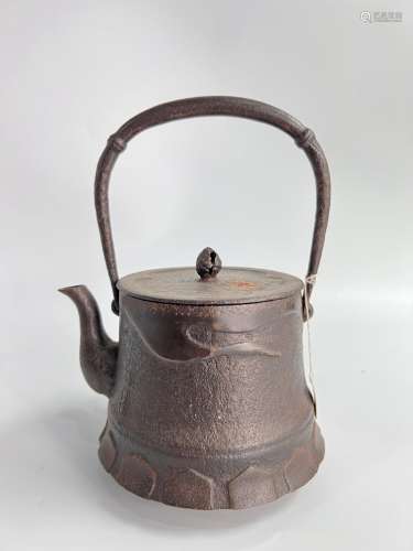 A heavy iron Japanese teapot, stamped.