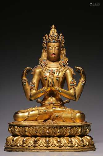 Qing Dynasty, bronze gilt inlaid treasure four-arm seated gu...