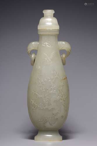 A white jade vase with flower and bird lid in Hetian, Qing D...