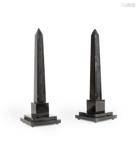 AFTER THE ANTIQUE, A PAIR OF OBELISKS IN BELGIAN BLACK MARBL...