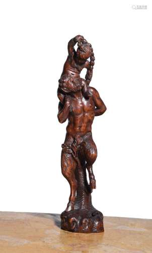 A CARVED WOOD FIGURE OF A FAUN WITH YOUNG BACCHUS, CIRCLE OF...