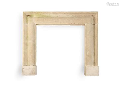 A LIMESTONE BOLECTION FIREPLACE SURROUND, 20TH CENTURY