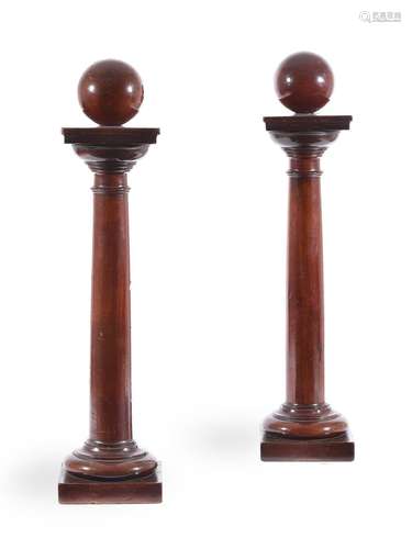 A PAIR OF MAHOGANY TABLE 'TUSCAN' COLUMNS WITH SPHERICAL FIN...