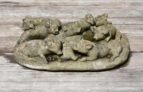 A COMPOSITION STONE GROUP OF PIGLETS, PROBABLY 1920