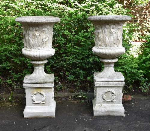 A PAIR OF LARGE CAST STONE URNS IN THE FORM OF THE MEDICI VA...