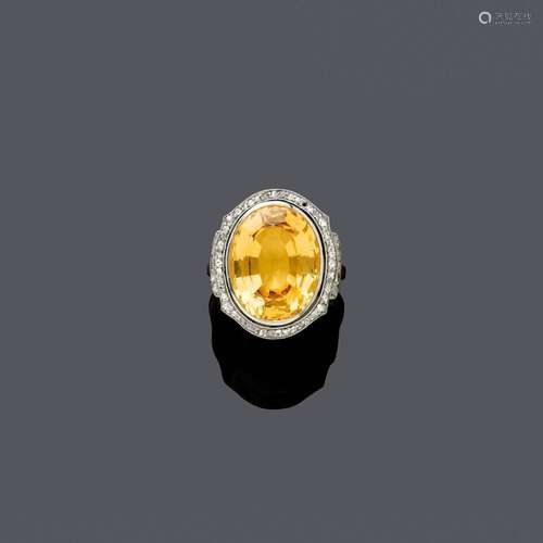 BAGUE TOPASE-DIAMANT, vers 1910.Platine et or jaune, 8g.Bagu...