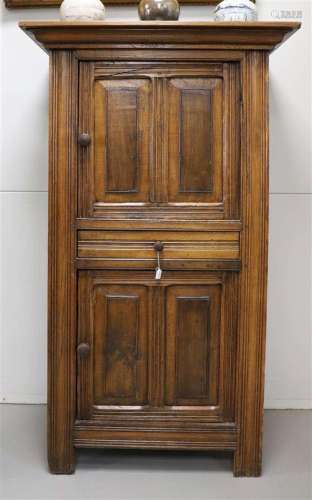 An oak two-door wardrobe with one drawer, 18th century and l...