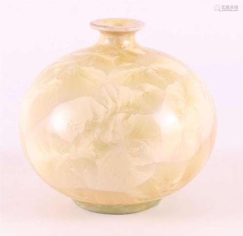 A yellow glazed spherical vase with crystal decoration, cont...