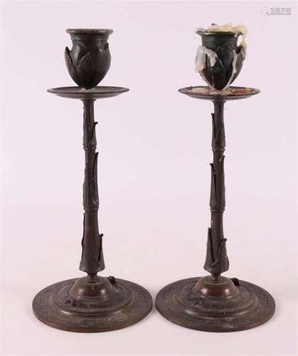 A pair of bronze single-light candlesticks, late 19th centur...