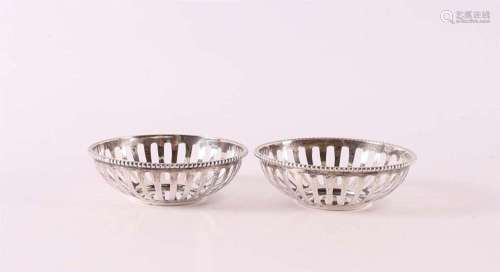 A pair of pierced 2nd grade 835/1000 silver bonbonnières wit...
