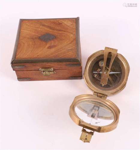 A brass compass, address 'Stanley London', in mahoga...