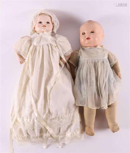 Two various dolls, including one with a cloth body, 1st half...