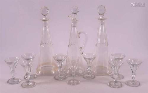 A lot of various glass, consisting of carafes and glasses, a...