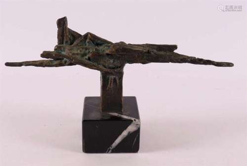 A brown patinated bronze abstract on black marble base, 20th...