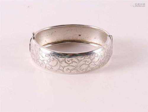 A 2nd grade 835/1000 silver rigid bracelet with floral decor...