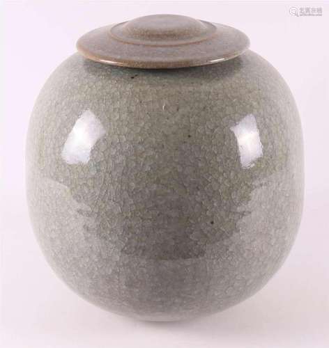 A gray stoneware lidded pot with crackle, presumably Johan B...