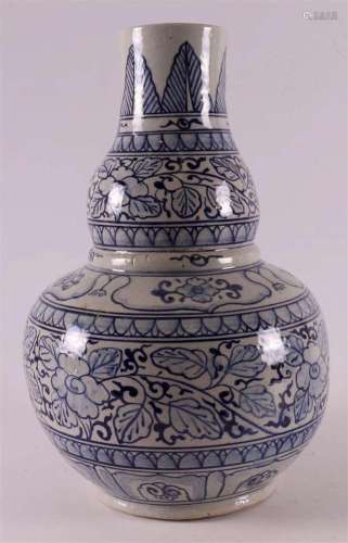 A blue and white gourd-shaped porcelain vase, China, 20th ce...