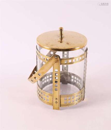 A cylindrical biscuit tin in brass mounting, ca. 1905.