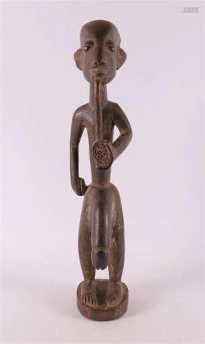 Ethnography. A wooden fertility statue of a man, Africa.