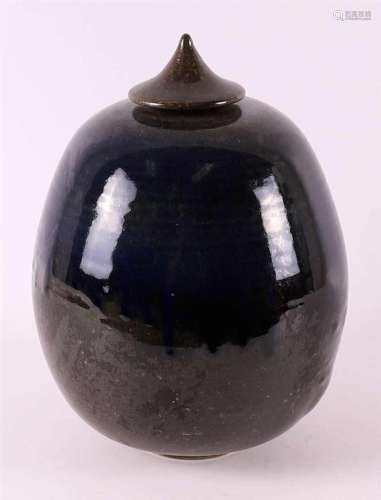 A blue/brown glazed stoneware lidded pot, 20th C.