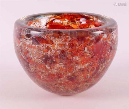 A thick-walled glass bowl with molten orange glass inside, B...