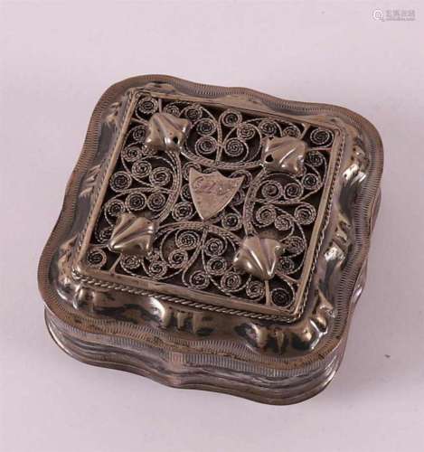 A 2nd grade 835/1000 silver pill box with filigree lid, 19th...